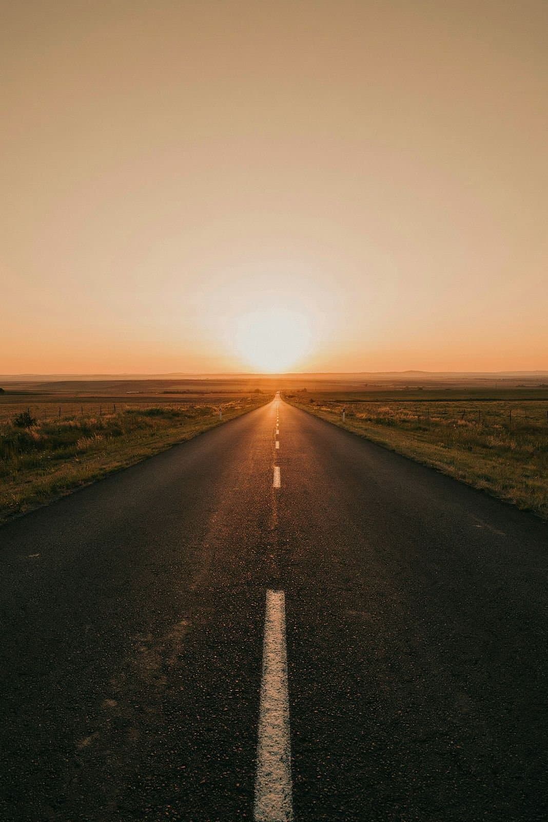 An open road toward the sunrise